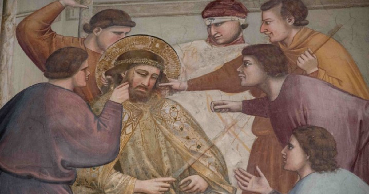 Giotto's Mocking of Christ fresco in the Scrovegni Chapel, Padua, showing figures taunting Jesus