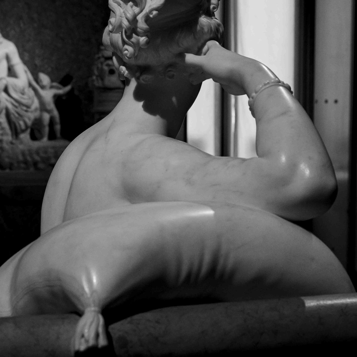Close rear view of Canova's Pauline Borghese as Venus, showing sculpted back and curled hair detail