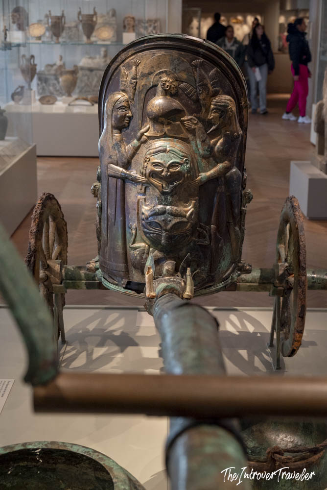 Ancient Etruscan bronze chariot with figural reliefs on display at the Metropolitan Museum of Art