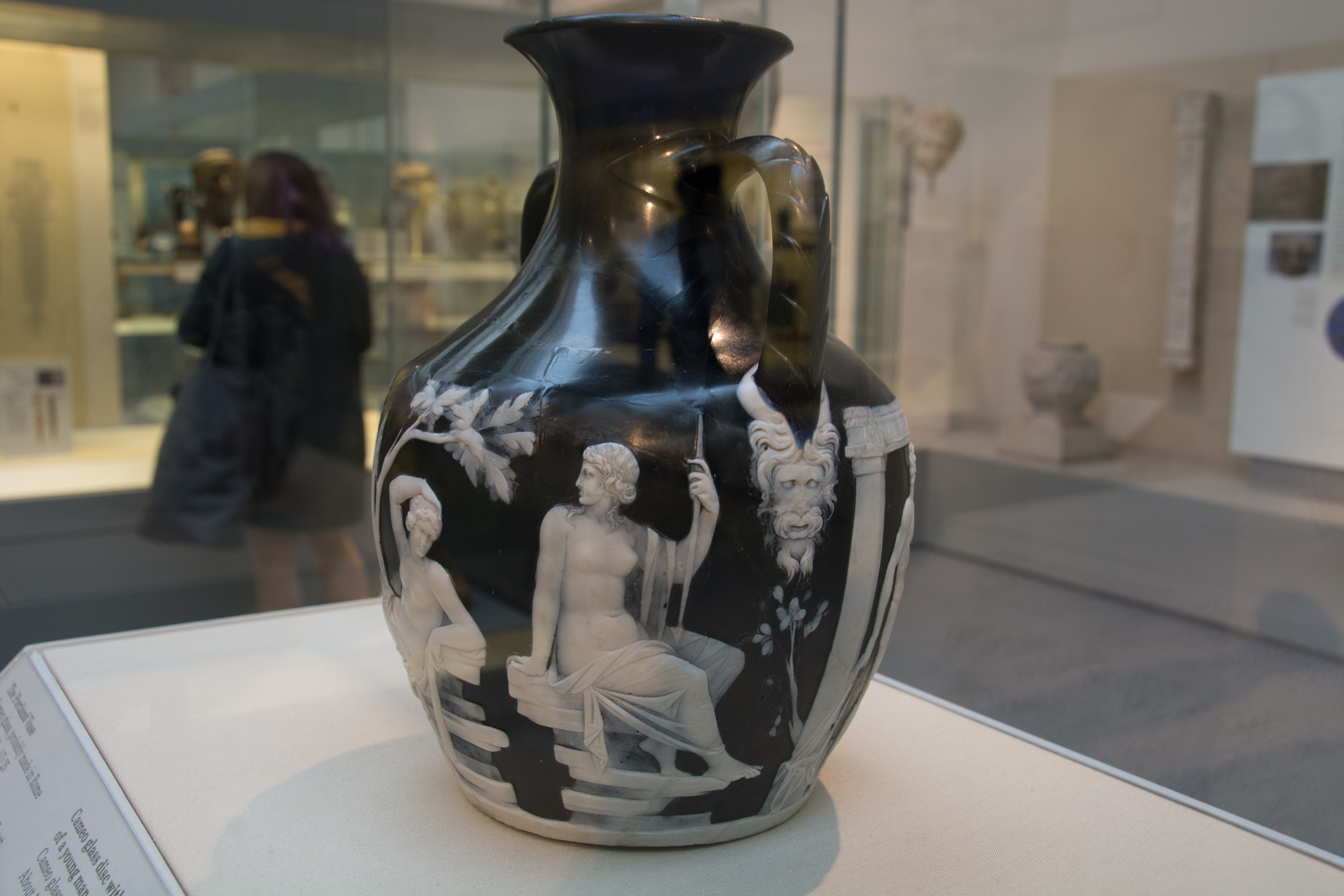 Black cameo glass jug with white relief figures, on display at the British Museum London