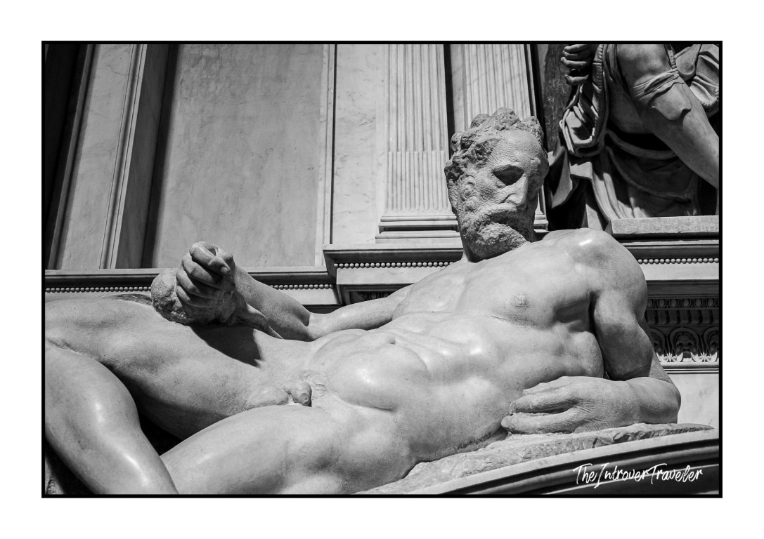 Close-up of Dusk by Michelangelo, reclining male figure on the Medici Tombs, Florence