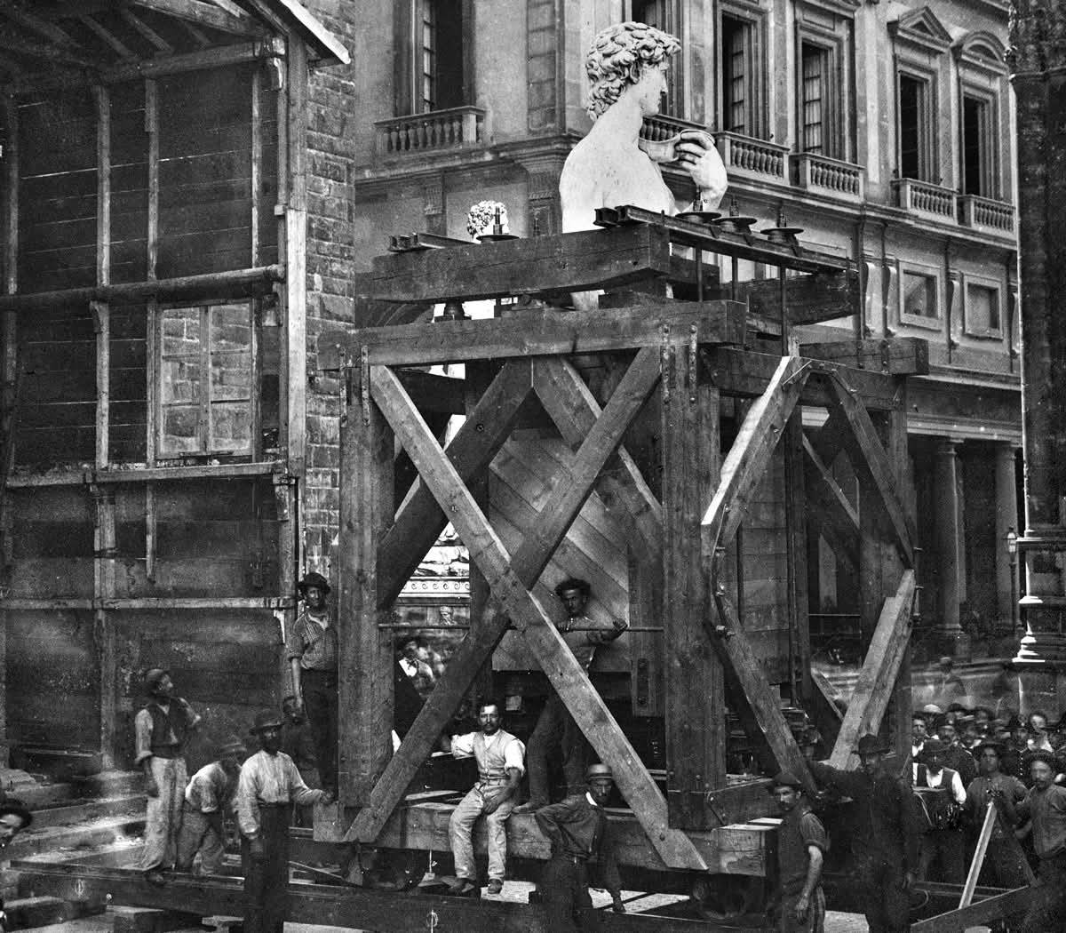 Historic 1873 transport of Michelangelo's David through Florence streets on a wooden cart