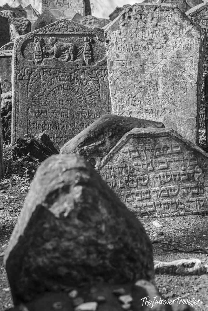 Ancient Hebrew-inscribed gravestones crowded together at the Old Jewish Cemetery in Prague