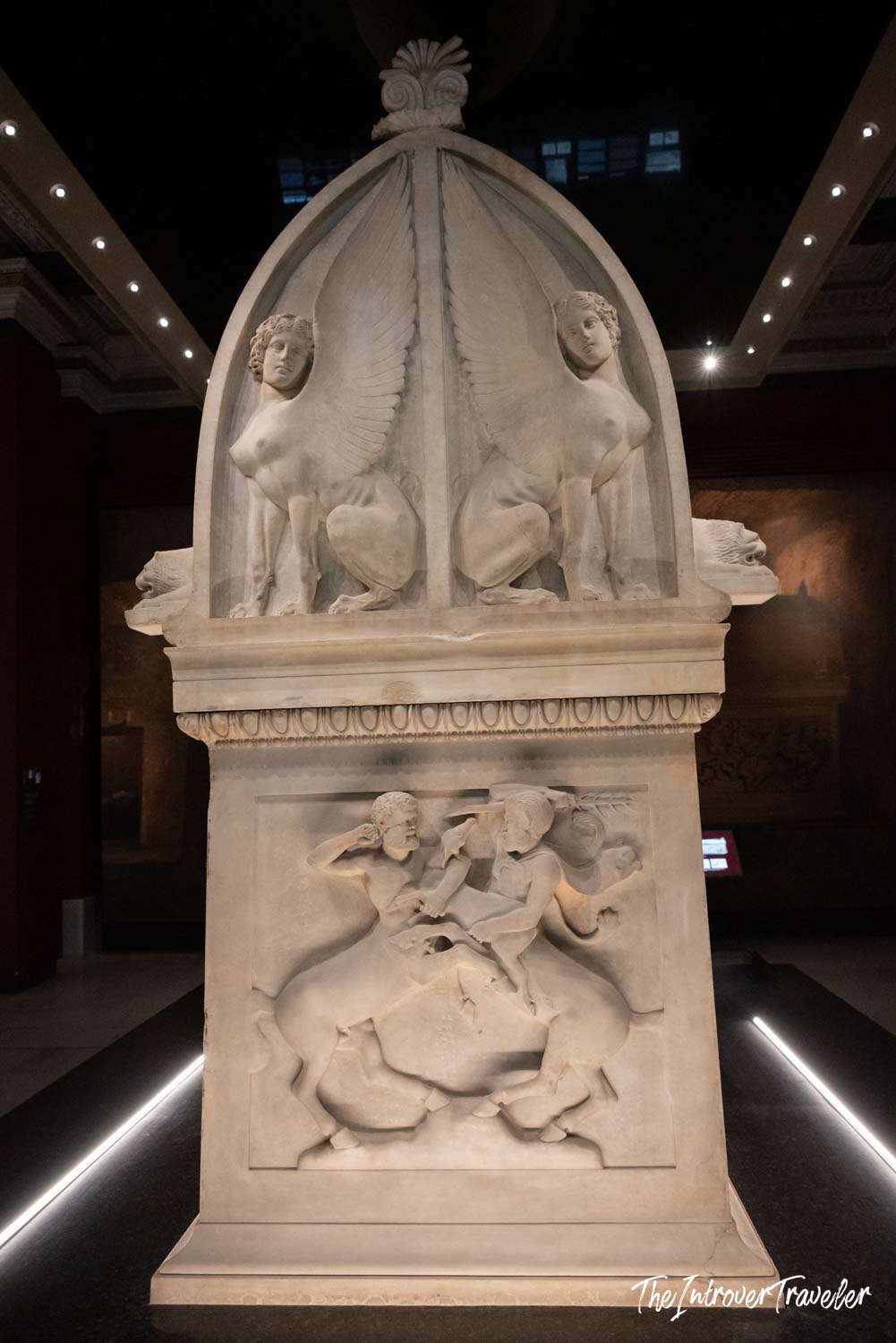 Ancient marble funerary stele with sphinx figures and relief carvings, Istanbul Archaeological Museum