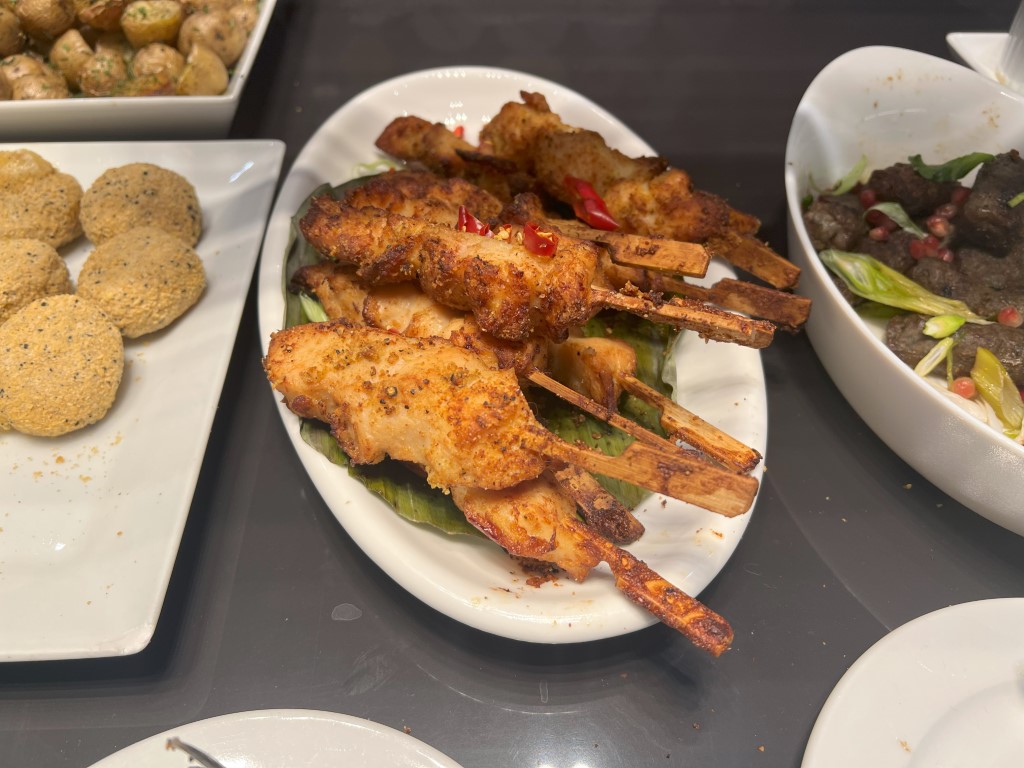 Spiced meat skewers on lemongrass sticks, part of the La Valette Lounge hot food buffet at Malta Airport