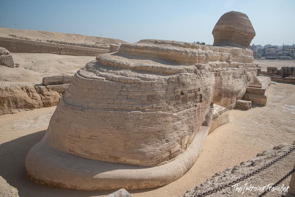 Rear view of the Great Sphinx of Giza, showing its limestone body and ancient repair blocks at Giza