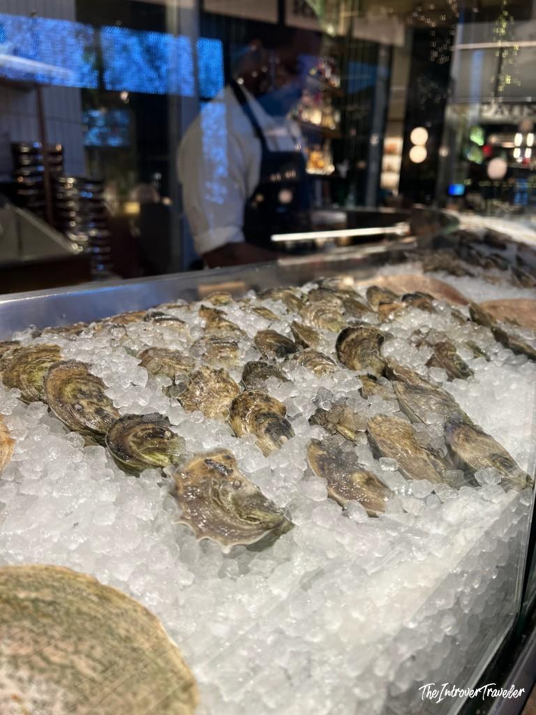 Fresh oysters on ice at Fulton Fish Bar, Pier 17 seafood restaurant in New York City