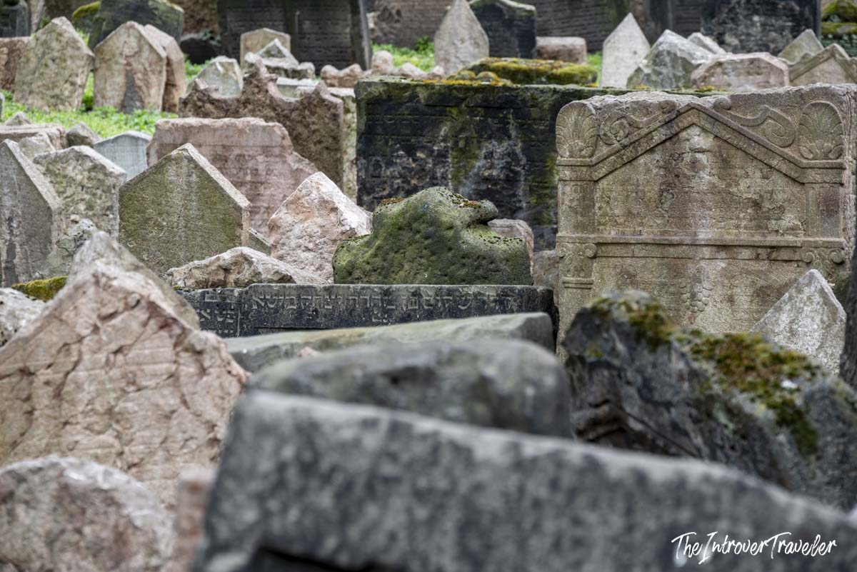 Densely packed ancient headstones with Hebrew inscriptions at the Old Jewish Cemetery in Prague