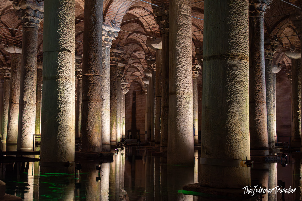 Rows of ancient marble columns reflected in still water inside the Basilica Cistern, Istanbul