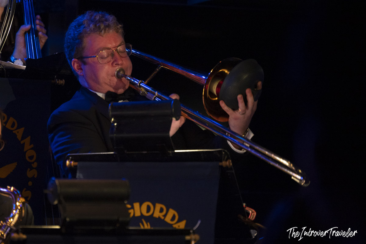 Trombone player with mute performing live with Vince Giordano and the Nighthawks at Birdland, New York