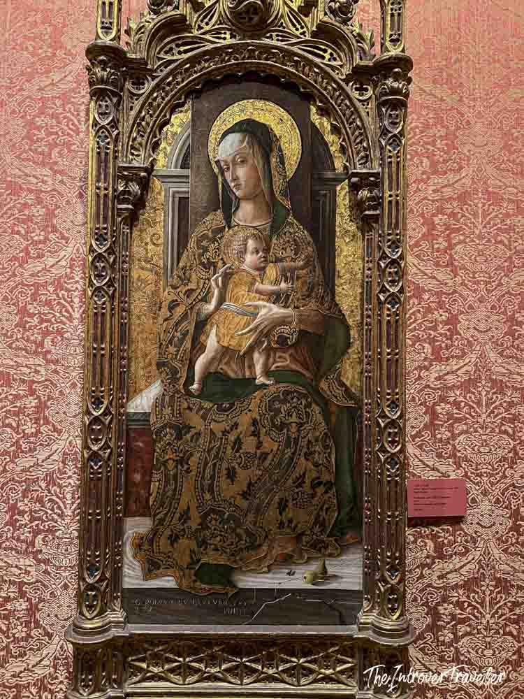 Madonna and Child enthroned painting in ornate gilded frame displayed at the Metropolitan Museum of Art