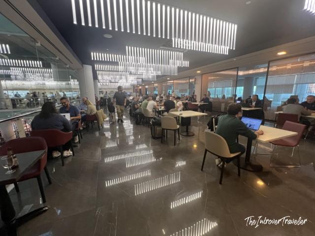 Busy seating area inside the Pau Casals VIP Lounge at Barcelona El Prat Airport