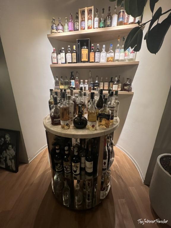 Extensive spirits and liqueur collection displayed at Trattoria Da Lucio, Rimini