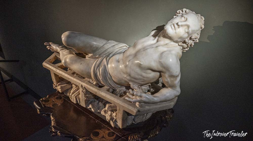 Marble sculpture of a reclining dying figure, a Baroque masterpiece on display at the Uffizi Gallery Florence