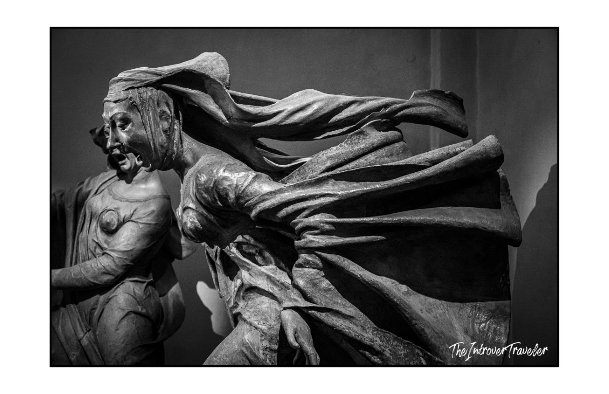 Dramatic wind-swept drapery detail on a weeping figure from Niccolò dell'Arca's Lamentation, Bologna