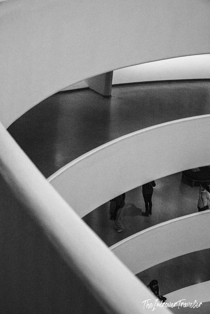 Guggenheim Museum New York spiral ramps viewed from above, with visitors below