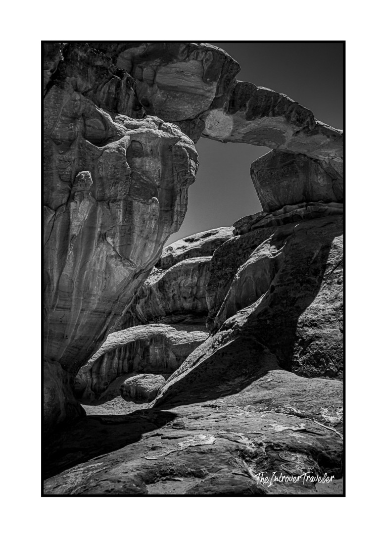 Black and white close-up of sculpted sandstone rock formations in Wadi Rum desert, Jordan