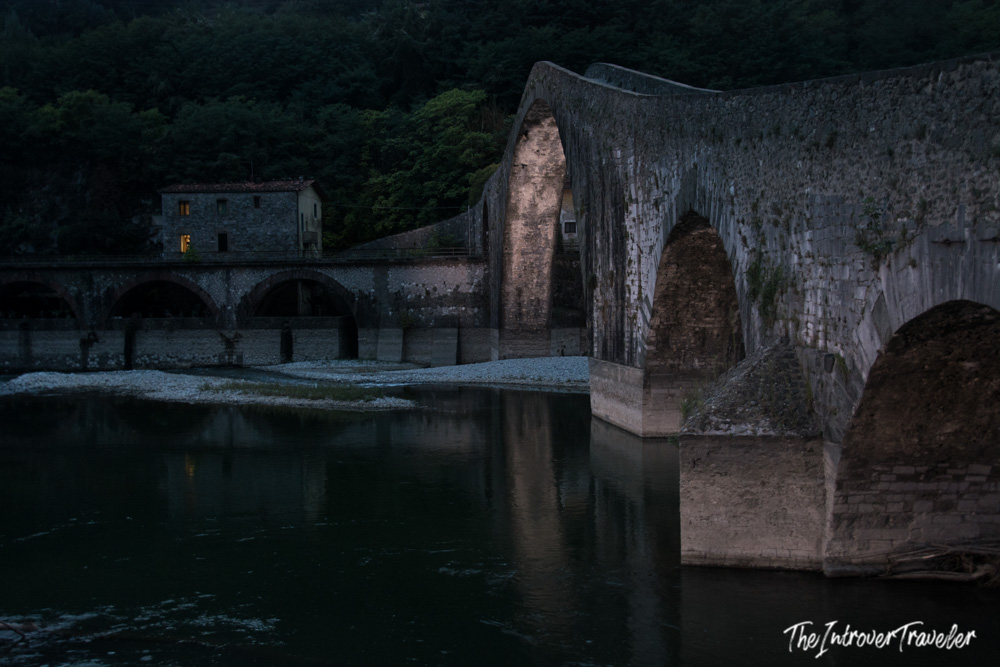Ponte della Maddalena at dusk, the Devil's Bridge reflected in the Serchio River, Borgo a Mozzano