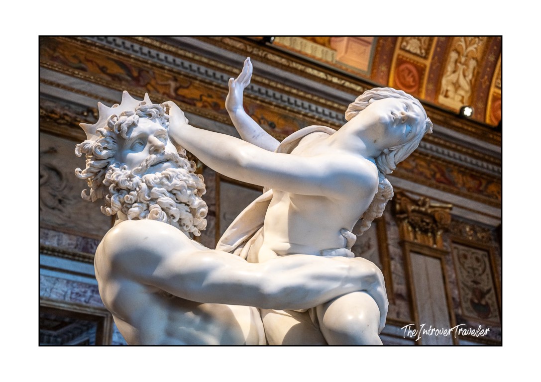 Bernini's Pluto and Proserpina close-up, showing Pluto's bearded face and Proserpina resisting his grip