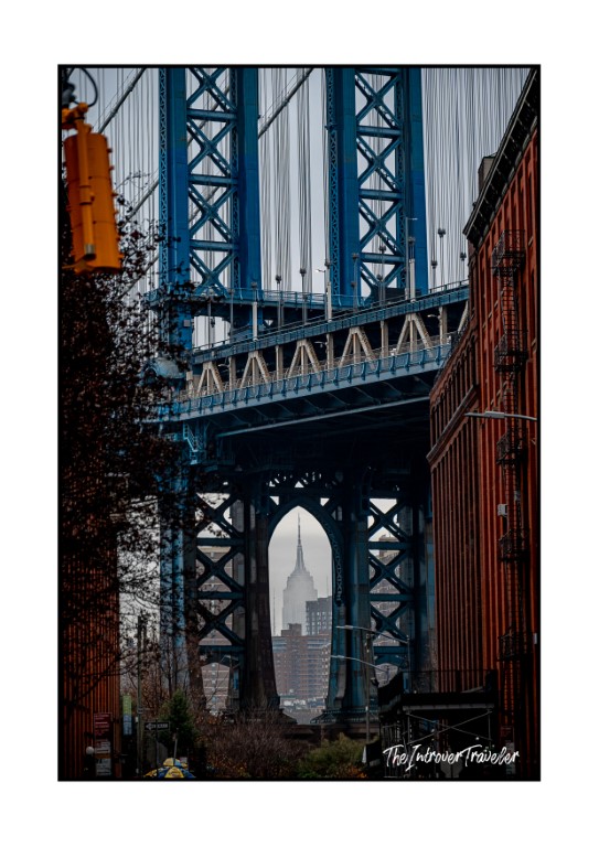 Manhattan Bridge tower framing the Empire State Building, seen from DUMBO Brooklyn