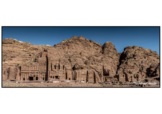 Panoramic view of the Royal Tombs carved into rose-red sandstone cliffs at Petra, Jordan