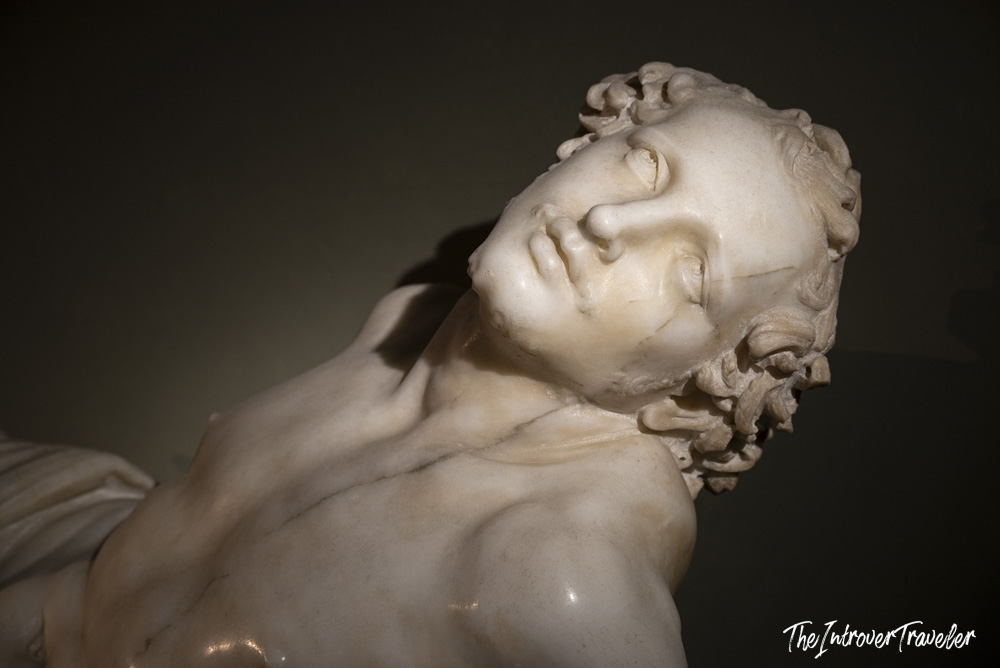 Close-up of Bernini's Saint Lawrence marble sculpture, showing the martyr's anguished upturned face at the Uffizi Gallery