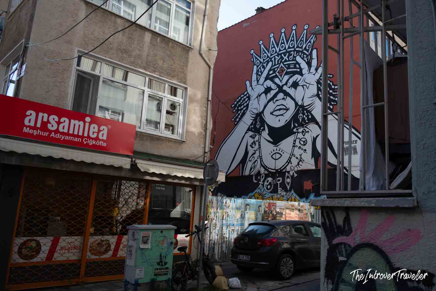 Black and white crowned figure mural on a building wall in Kadıköy, Istanbul street art scene