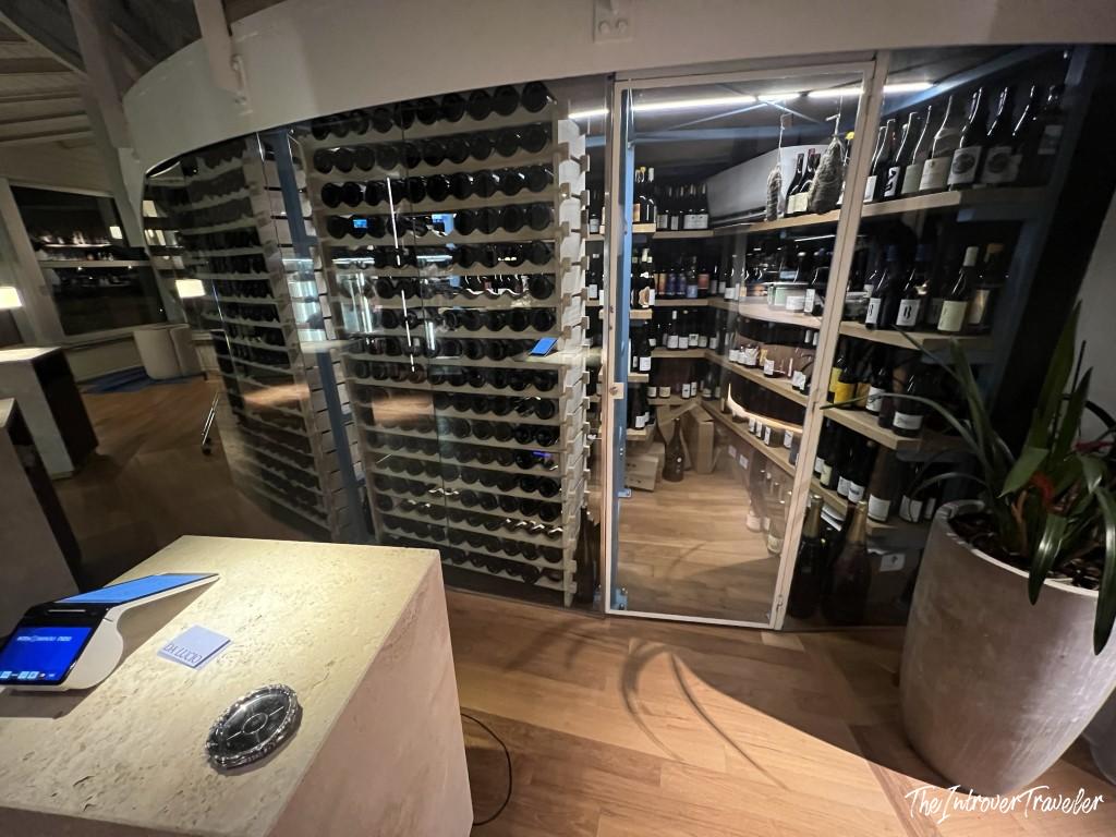Glass-enclosed wine cellar at Trattoria Da Lucio, a fine dining seafood restaurant in Rimini
