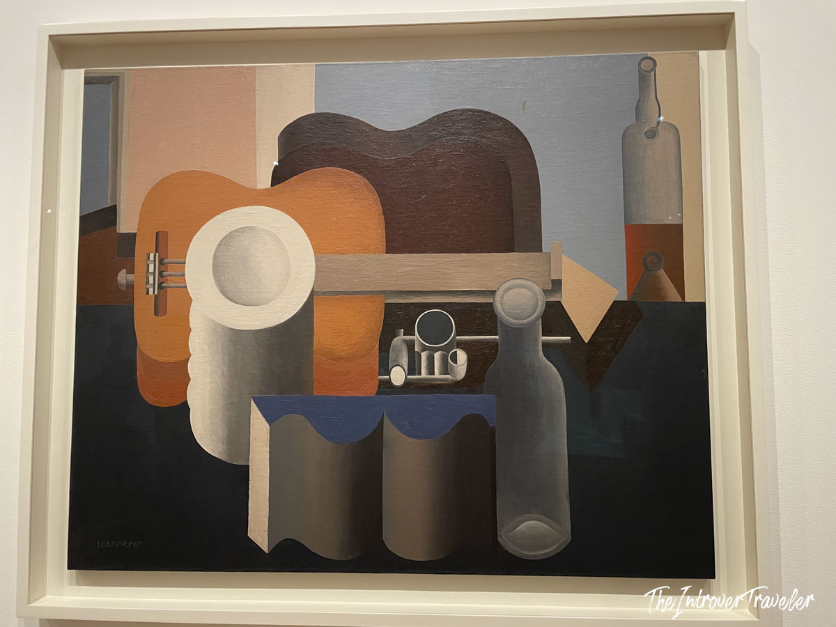 Purист still life painting by Jeanneret (Le Corbusier) with guitar and bottles, on display at MoMA New York