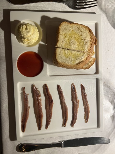 Fresh Cantabrian anchovies served with bread and sauce at L'Ebbrezza di Teonilla, Naples