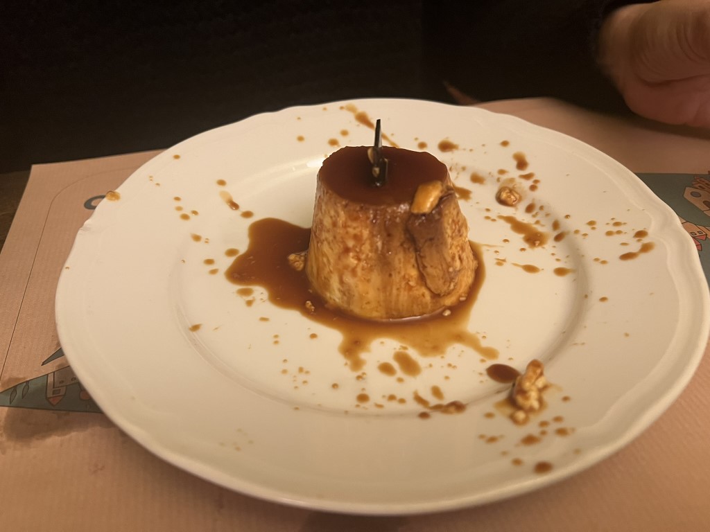 Caramel panna cotta with walnut garnish at Trattoria Cibrèo in Florence
