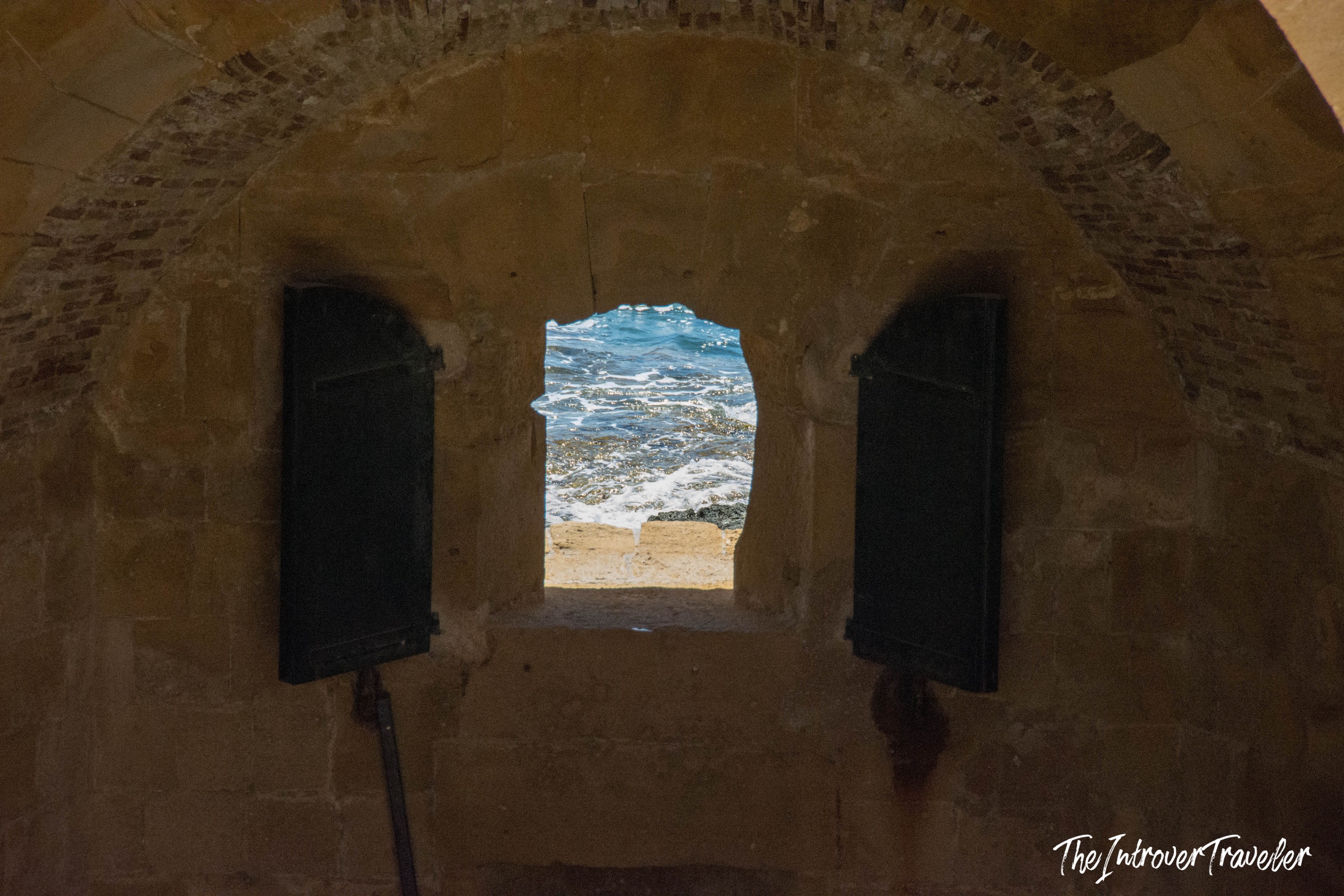 View through a Castello Maniace gun embrasure toward the sea in Ortigia, Syracuse