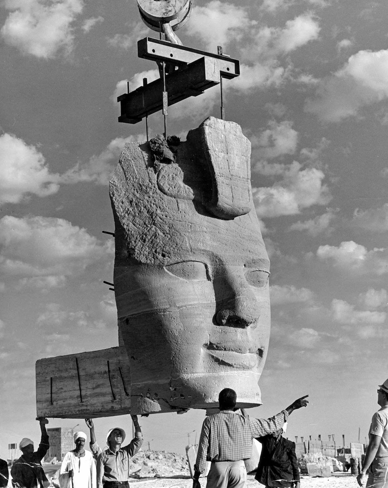 Colossal sandstone head of Ramesses II lifted by crane during Abu Simbel temple relocation, 1960s