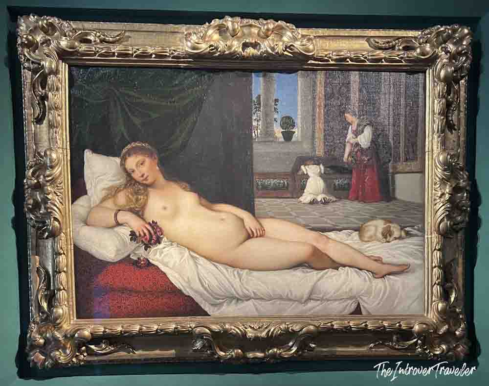 Titian's Venus of Urbino in an ornate gold frame, a Renaissance masterpiece at the Uffizi Gallery Florence