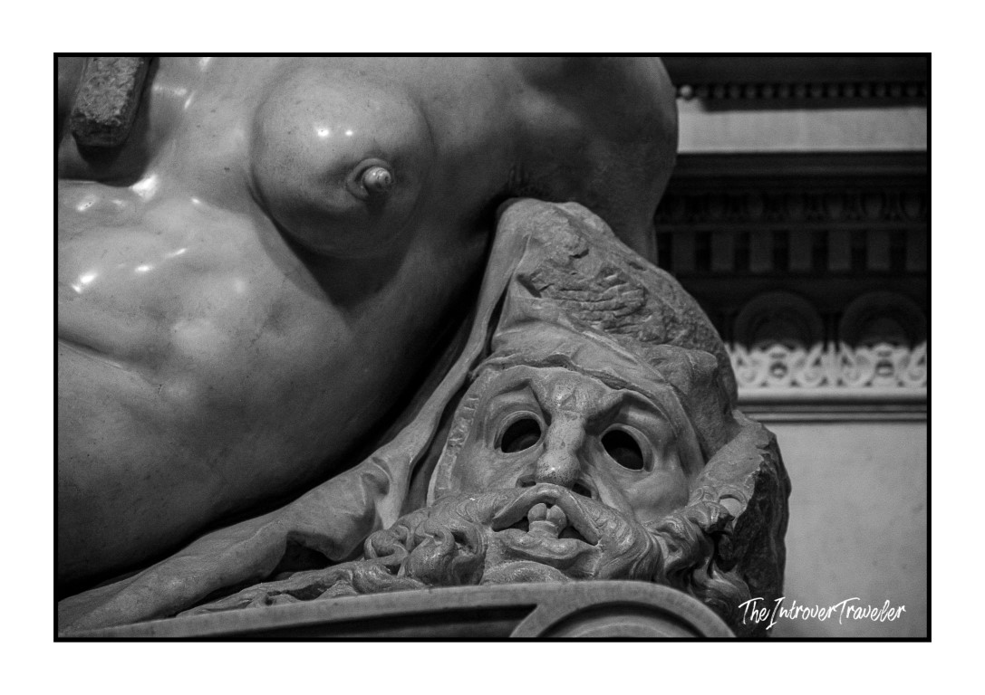 Close-up of a tragic mask detail on a Medici Tombs sculpture by Michelangelo, Florence