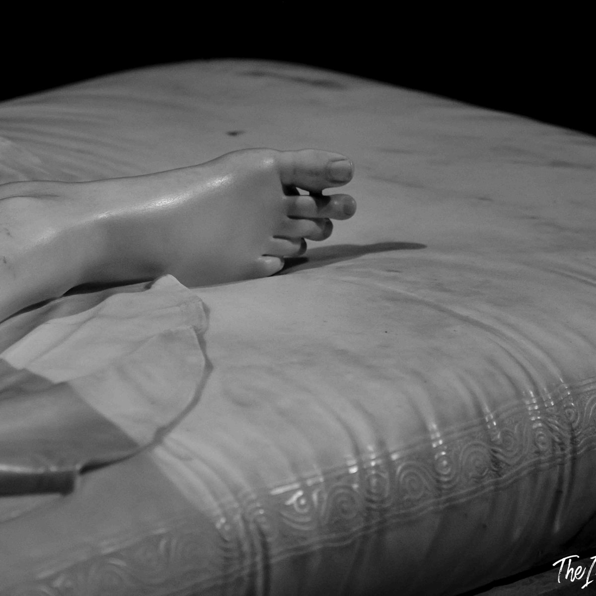 Close-up of Canova's Pauline Borghese marble foot, showing exquisite detail in the carved drapery beneath