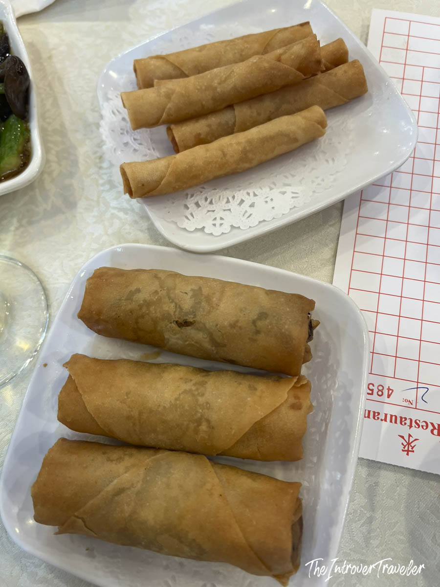 Two plates of crispy fried spring rolls served at House of Joy, Chinatown Manhattan
