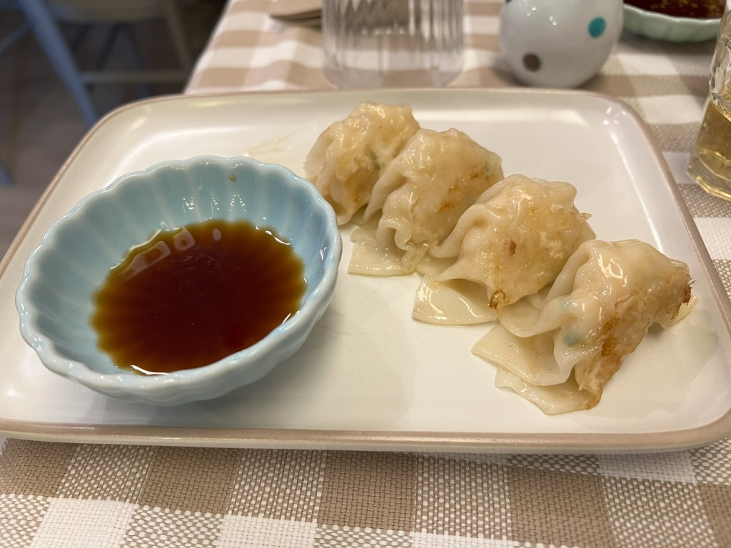 Pan-fried gyoza with dipping sauce at Yuzuya, Japanese restaurant in Bologna