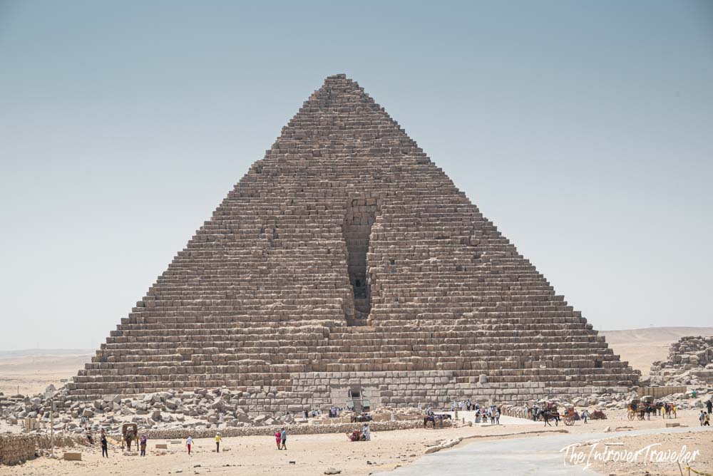Pyramid of Menkaure at Giza, showing the medieval breach on its north face and tourists below