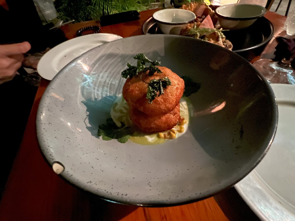 Crispy fish fillet with huitlacoche and zucchini sauce, plated at Kondesa restaurant in Cozumel