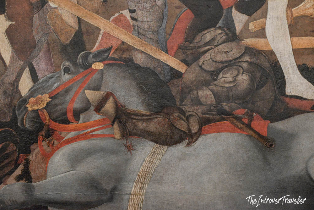 Close-up detail of a fallen horse in a battle scene painting at the Uffizi Gallery, Florence