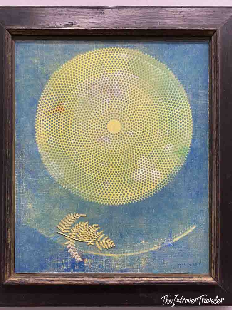 Painting with yellow dotted circle and golden fern on blue, displayed at the Albertina Museum Vienna