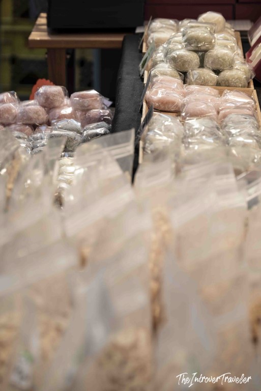 Colorful mochi balls in plastic bags displayed at a Tsukiji market sweet stall, Tokyo