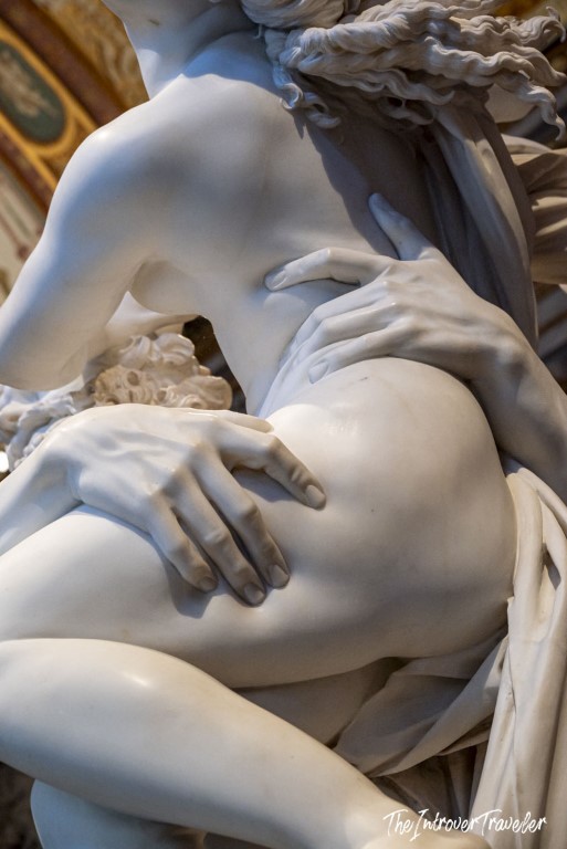 Close-up of Bernini's Pluto and Proserpina, showing fingers pressing into Proserpina's thigh at Borghese Gallery