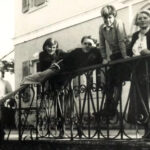 Vintage black and white photo of the Durrell family posing on a wrought iron balcony in Corfu