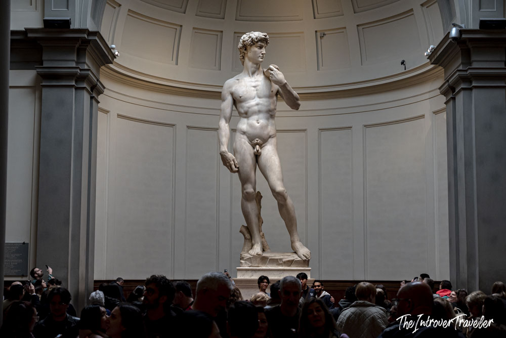 Michelangelo's David towering over crowds at the Galleria dell'Accademia in Florence