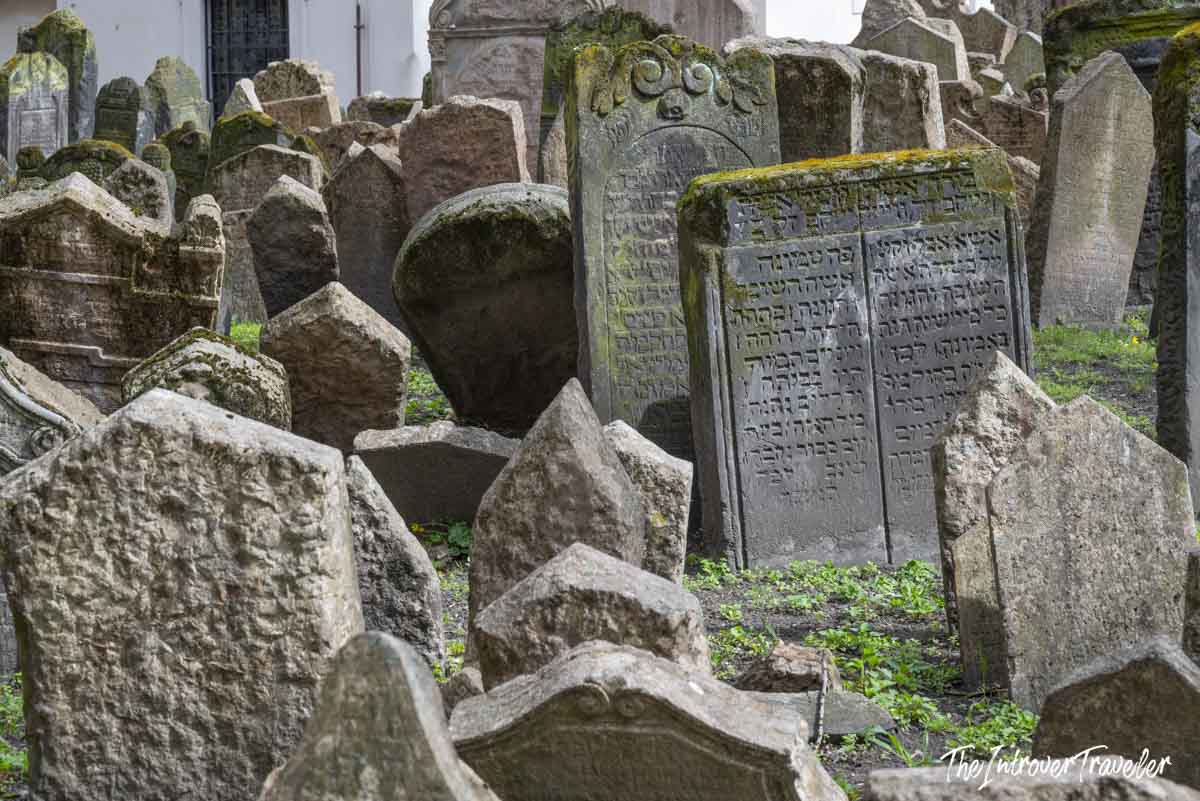 Densely packed Hebrew-inscribed gravestones at the Old Jewish Cemetery in Prague's Josefov quarter