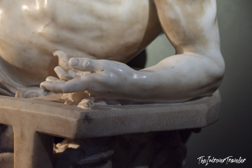 Close-up of the open hand of Bernini's Saint Lawrence marble sculpture at the Uffizi Gallery