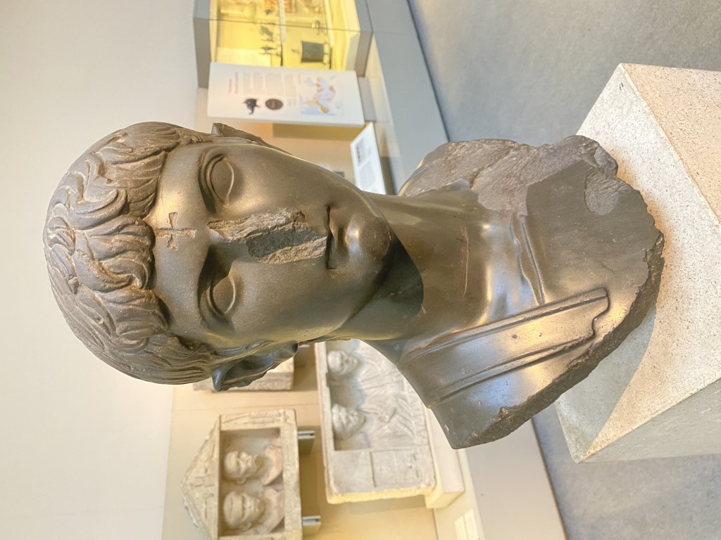 Bronze Roman bust with damaged nose on display at the British Museum, London