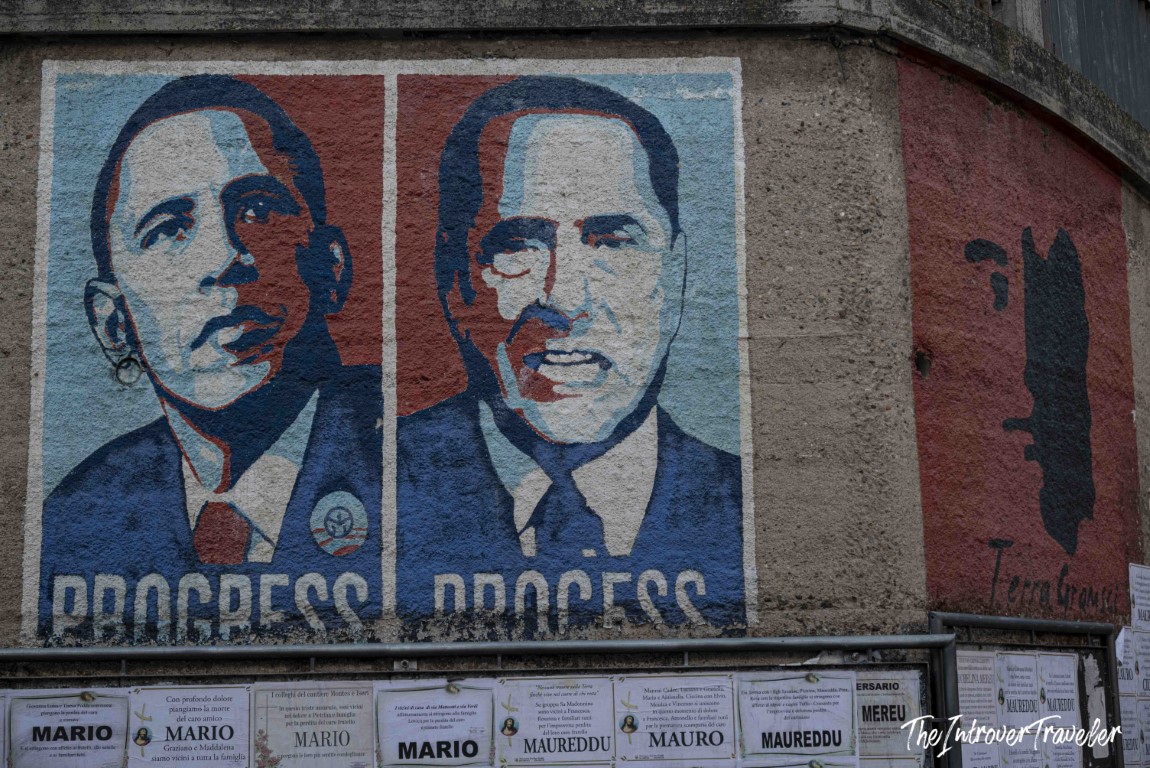 Orgosolo mural showing Obama labeled Progress beside Berlusconi labeled Process, Sardinia street art